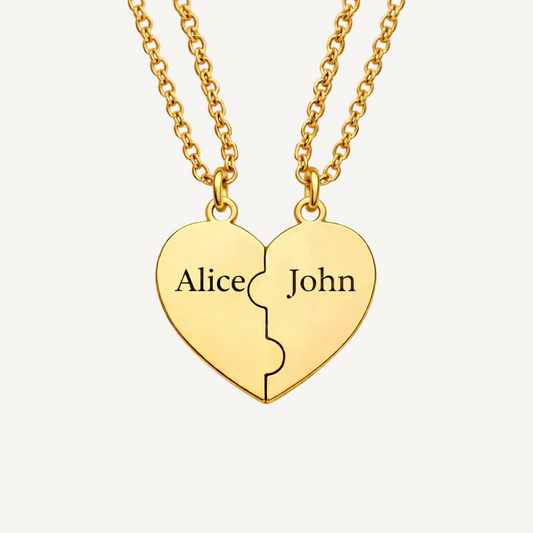 Gold heart-shaped pendant with 'Alice' and 'John' engraved on a beige background