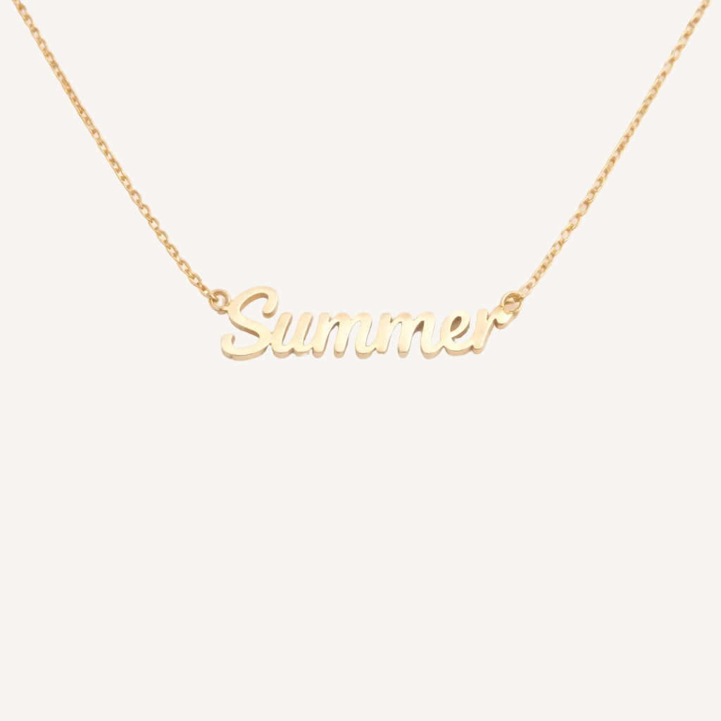 Gold necklace with 'Summer' pendant on a white background