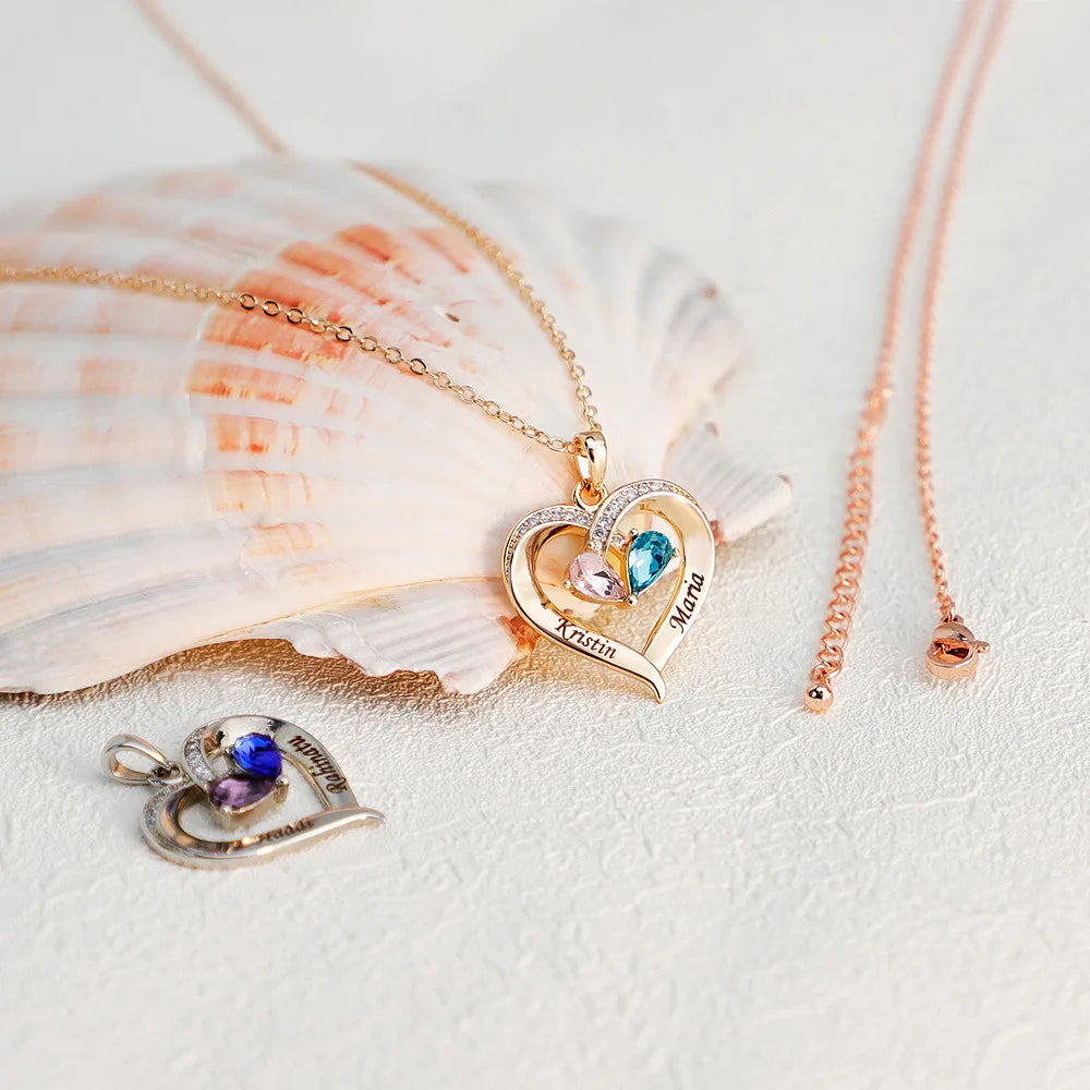 Heart-shaped necklaces with gemstones on a sea she;; with a light background