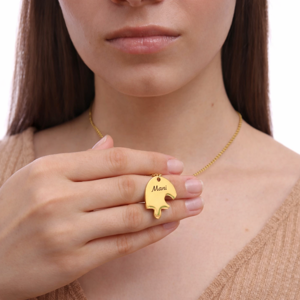 Woman holding engraved puzzle piece heart necklace with white background
